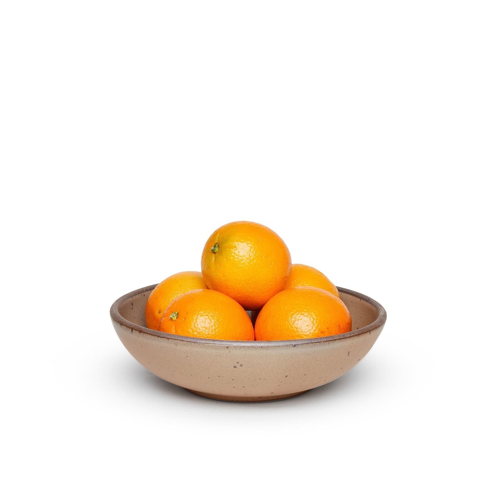 Verllage daily bowl in Warm Taupe, shown with oranges