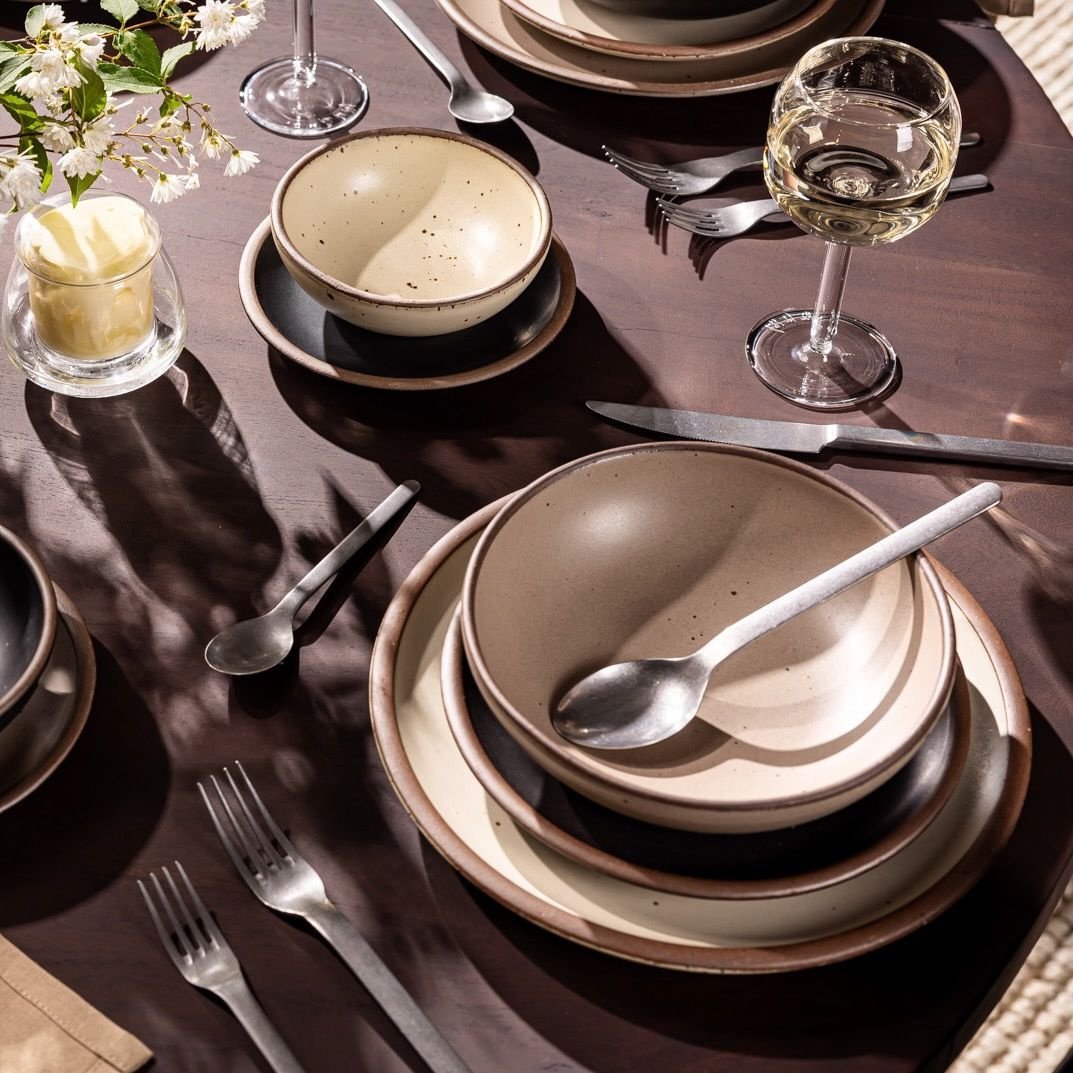 Verllage daily bowl in Warm Taupe, in a table setting with other dinnerware