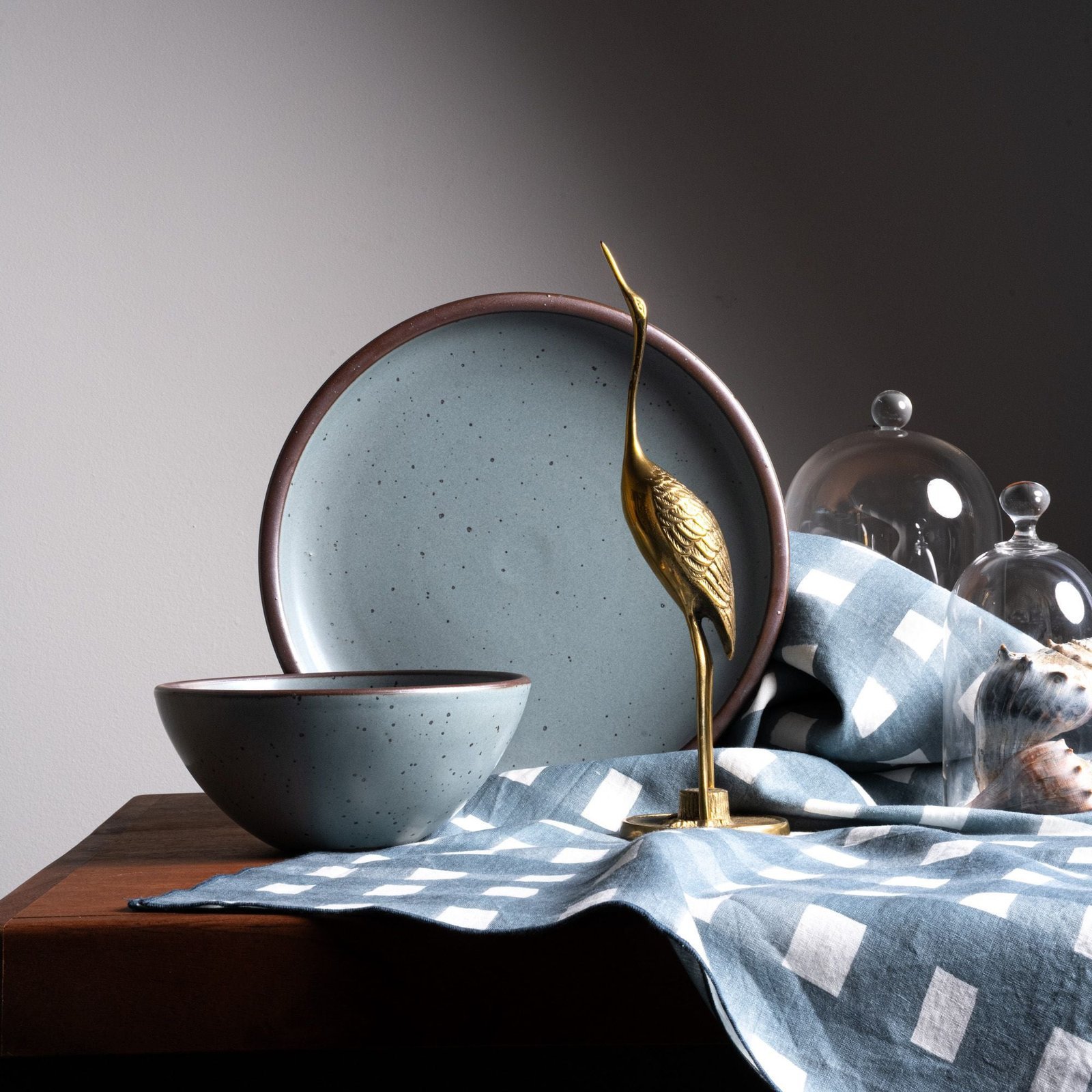 Verllage soup bowl in Mist Blue, in a display with other tableware