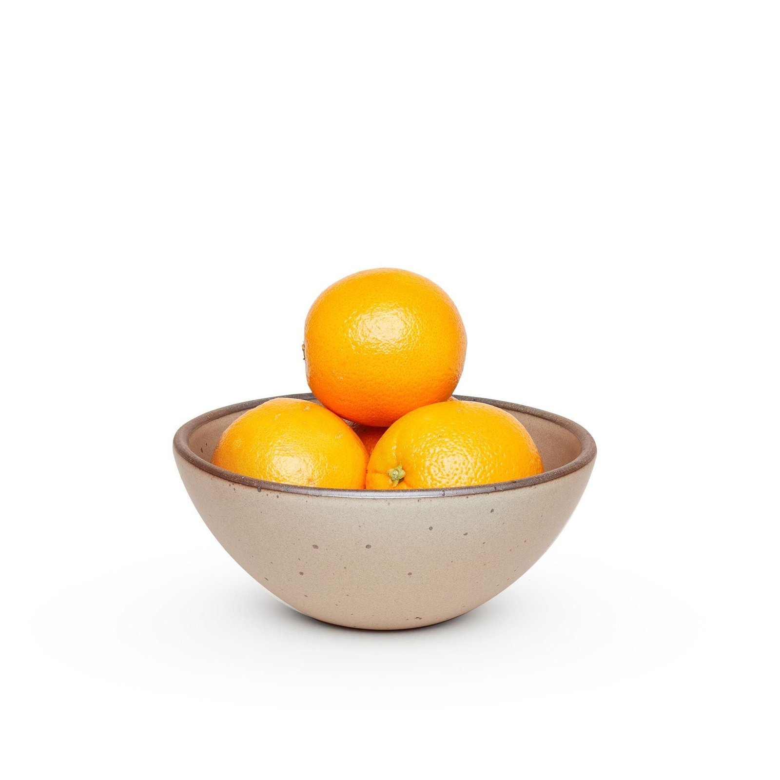 Verllage soup bowl in Warm Taupe, shown with oranges
